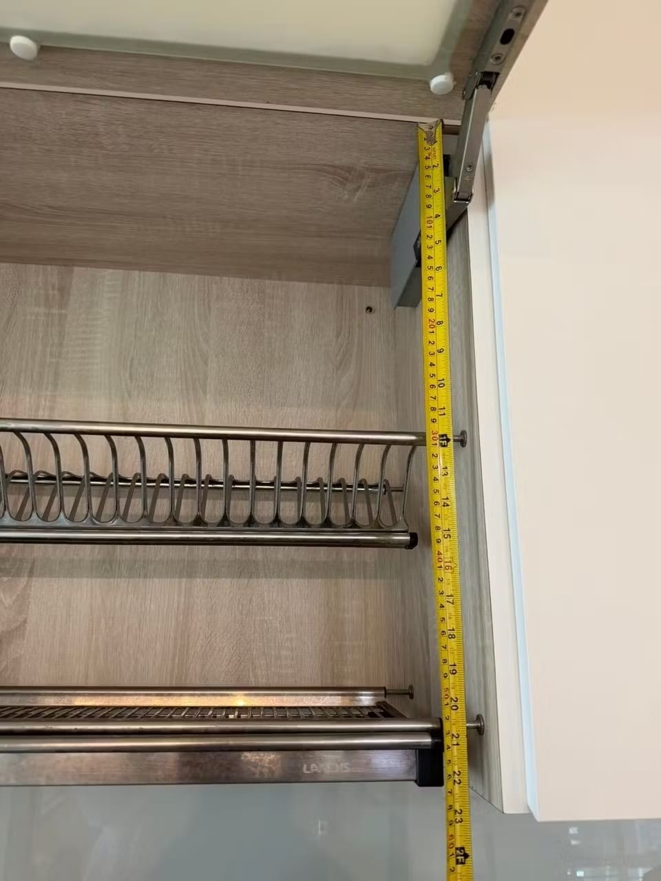 Measuring internal cabinet height with measuring tape