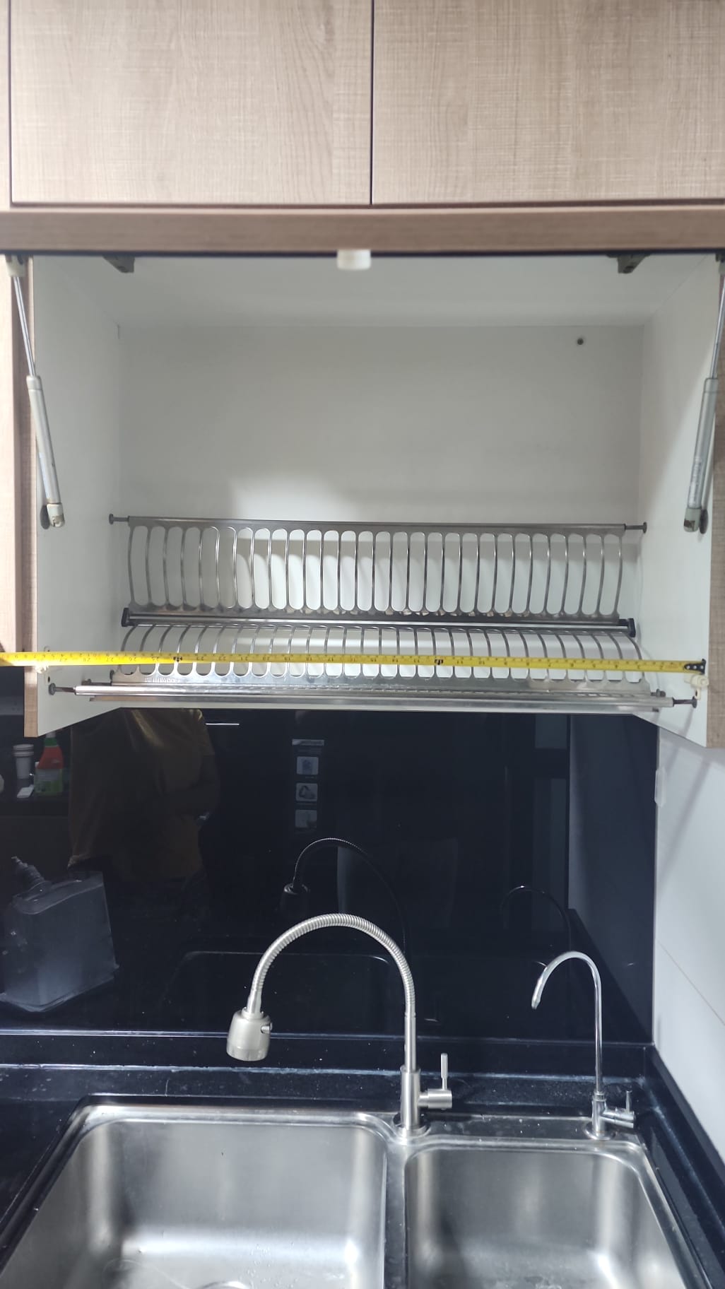 Old basic dish rack in existing cabinet before replacement with Higold lifting rack