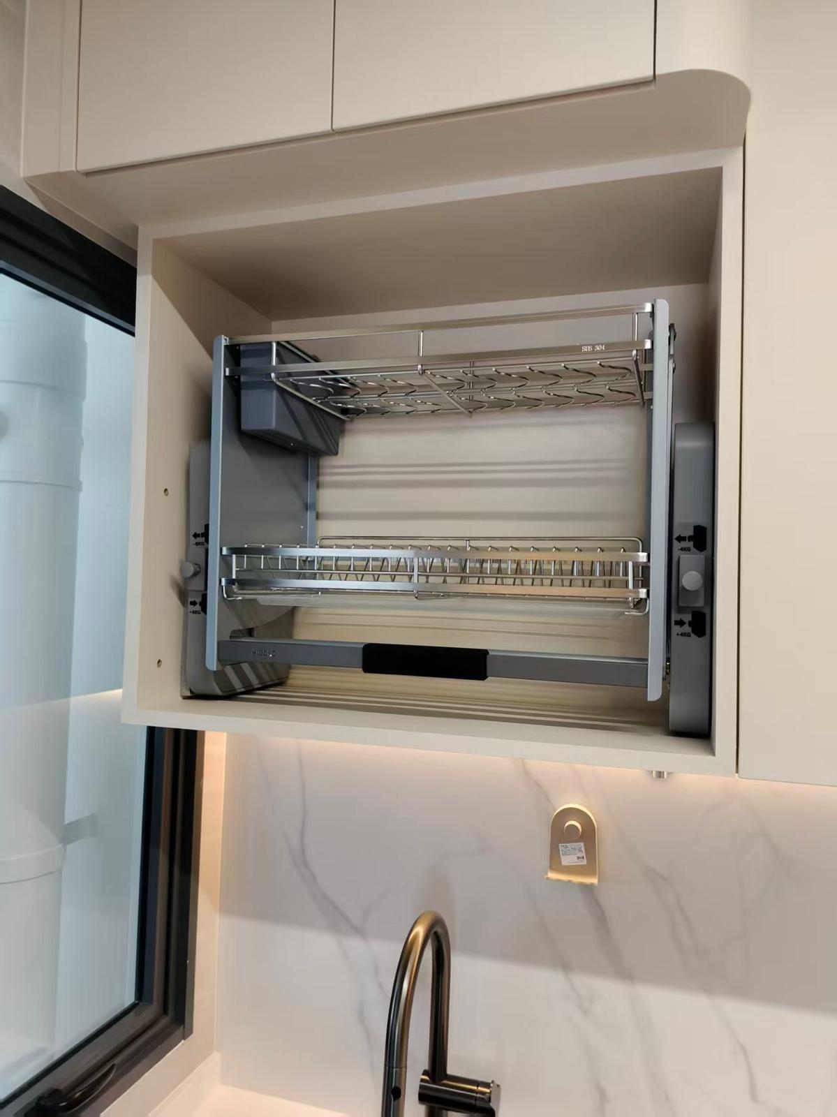 Higold lifting dish rack installed in cream cabinet, Singapore home