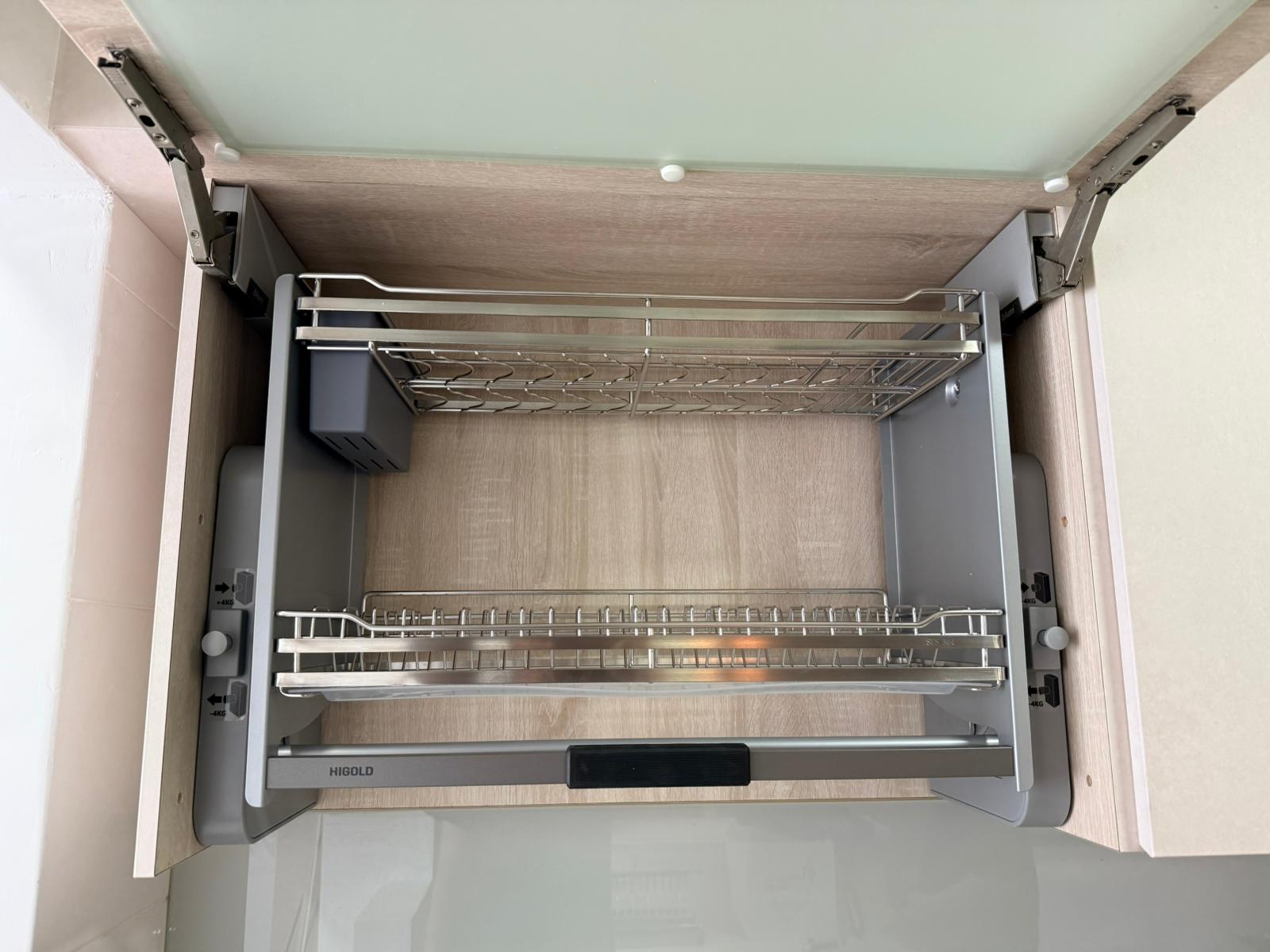 Higold lifting rack installed in oak-tone cabinet interior