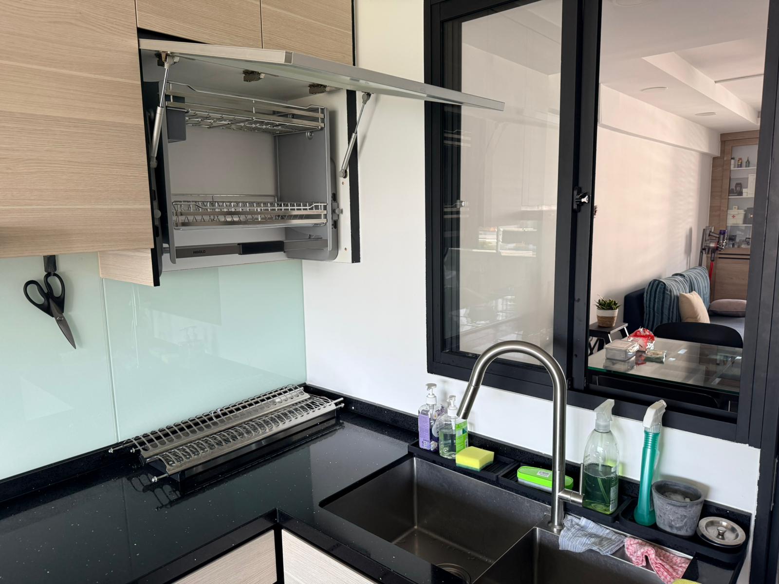Higold lifting rack installed in kitchen with lift-up cabinet door